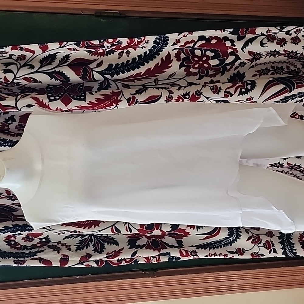 Shear white sleeveless blouse